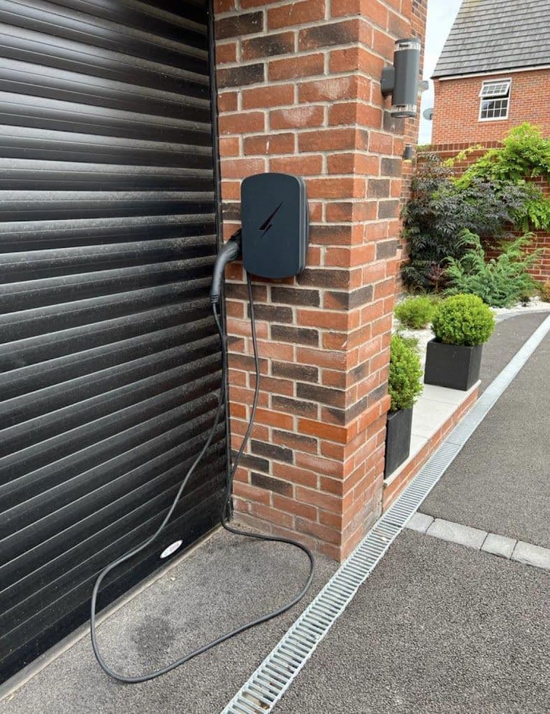 EV charger installed beside a domestic garage